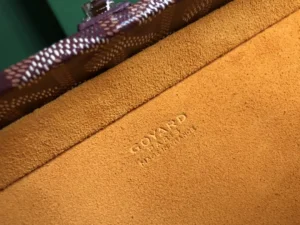 Goyard bag interior tan suede lining embossed logo luxury craftsmanship detail close-up