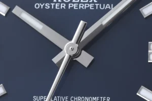 Rolex Oyster Perpetual blue dial stainless steel watch with silver hands and markers close-up