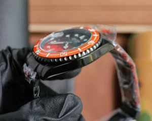 Rolex Submariner 116610LN black dial orange ceramic bezel stainless steel watch with black strap