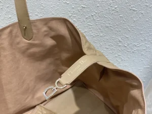 Christian Dior tote bag beige canvas leather interior with branded silver clasp detail