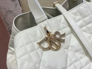 Dior Lady Dior medium white quilted leather bag with gold metal charm detail