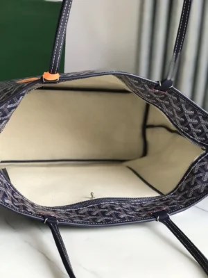 Goyard tote bag interior view showcasing spacious design, high-quality craftsmanship, and signature pattern.