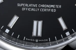 Rolex Oyster Perpetual black dial stainless steel watch with luminous markers and Swiss made text