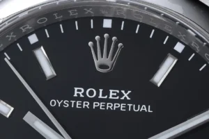 Rolex Oyster Perpetual black dial stainless steel case watch with silver hour markers and hands