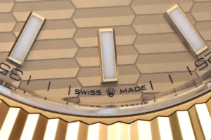 Rolex Day-Date gold dial fluted bezel yellow gold case luxury watch close-up detail