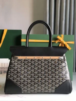 Goyard Saigon Tote bag featuring a distinctive patterned design, black leather accents, and a sleek silhouette, set against a backdrop with green gift boxes, highlighting luxury and elegance.