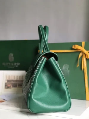 Goyard Saigon Tote bag in green leather, showcasing elegant design and distinctive shape, with a luxury gift box in the background.