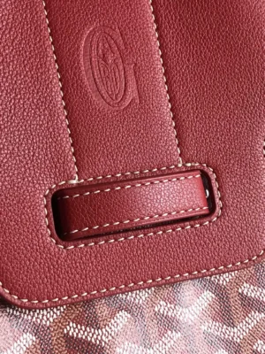 Goyard Saigon Tote bag detail featuring textured leather strap and embossed logo, emphasizing luxury craftsmanship and design.