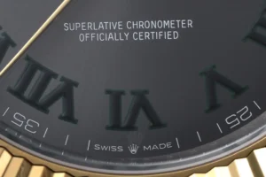 Rolex Datejust black dial fluted bezel yellow gold wristwatch close-up dial text and markings