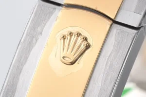 Rolex watch bracelet close-up two-tone stainless steel and yellow gold with embossed crown logo clasp