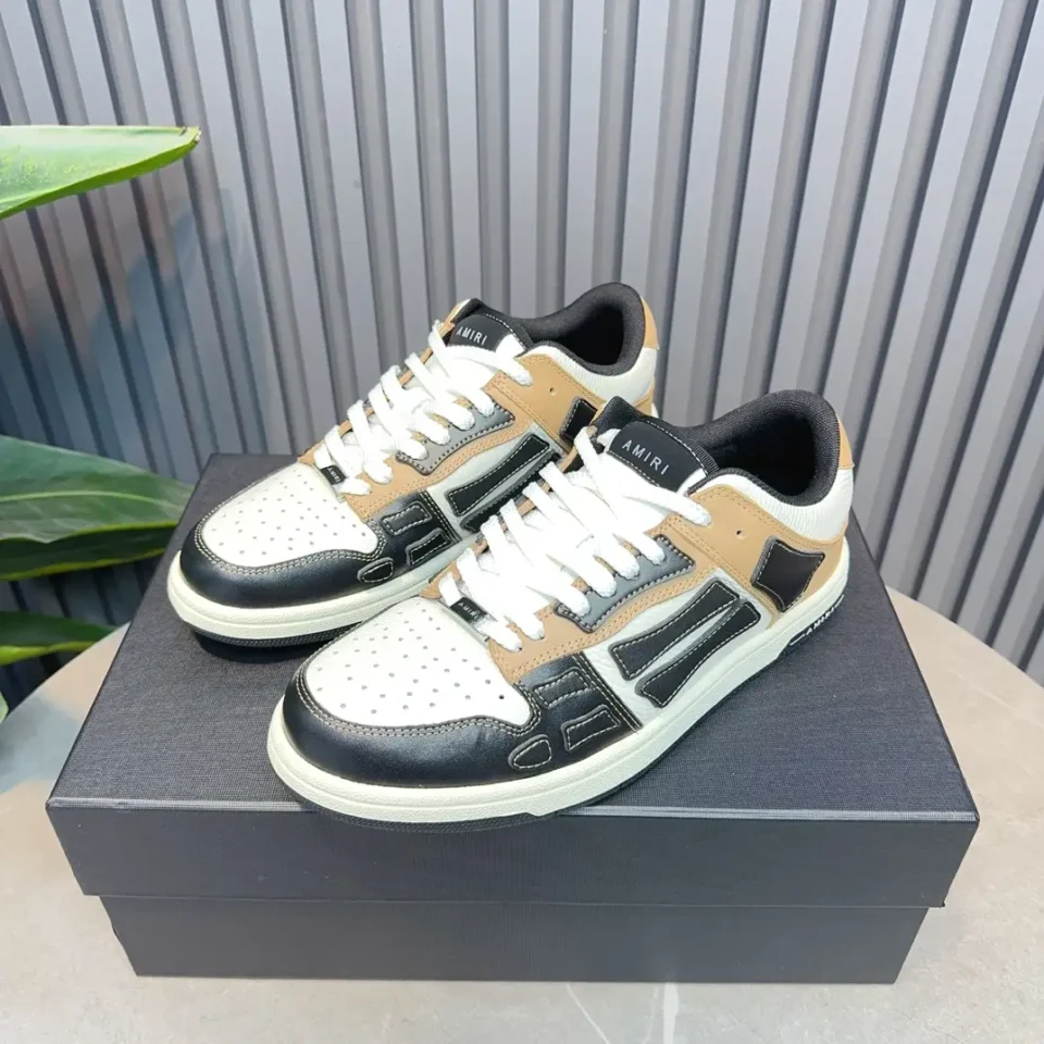 Amiri Skel Top Low white tan black leather sneakers with perforated toe and lace-up design