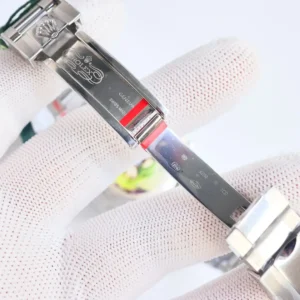 Rolex watch clasp stainless steel with engraved logo and Swiss made markings close-up detail