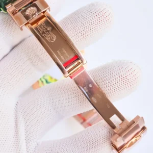 Rolex watch clasp inside view rose gold metal with engraved Rolex logo and Swiss made markings