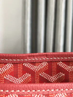 Goyard Hobo Boh è Me Stray Bag interior detail showcasing red patterned fabric and stitching, emphasizing luxury design and craftsmanship.