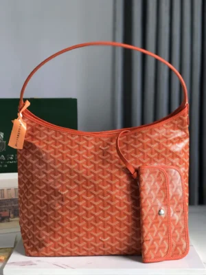 Goyard Hobo Boh è Me Stray Bag in vibrant orange with matching pouch, showcasing casual and trendy design elements.