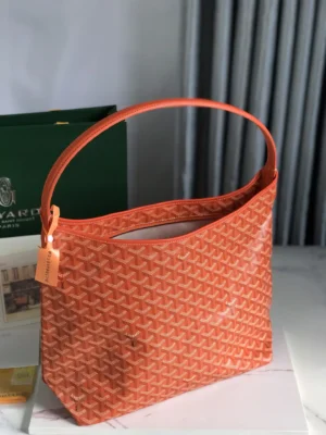 Goyard Hobo Boh è Me Stray Bag in vibrant orange with textured design, showcasing stylish underarm carry and trendy casual aesthetic.