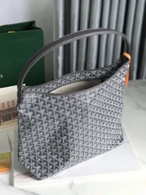 Goyard Hobo Boh è Me Stray Bag in gray with distinctive pattern, featuring a comfortable shoulder strap, showcased on a marble surface, highlighting its stylish design for fashion enthusiasts.