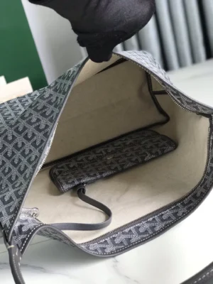 Interior view of Goyard Hobo Boh è Me Stray Bag featuring a spacious compartment and a small zippered pouch, showcasing its stylish design and premium materials.