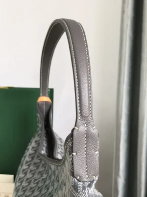 Goyard Hobo Boh è Me Stray Bag underarm bag featuring a gray leather handle and intricate pattern, showcasing the design details and craftsmanship.