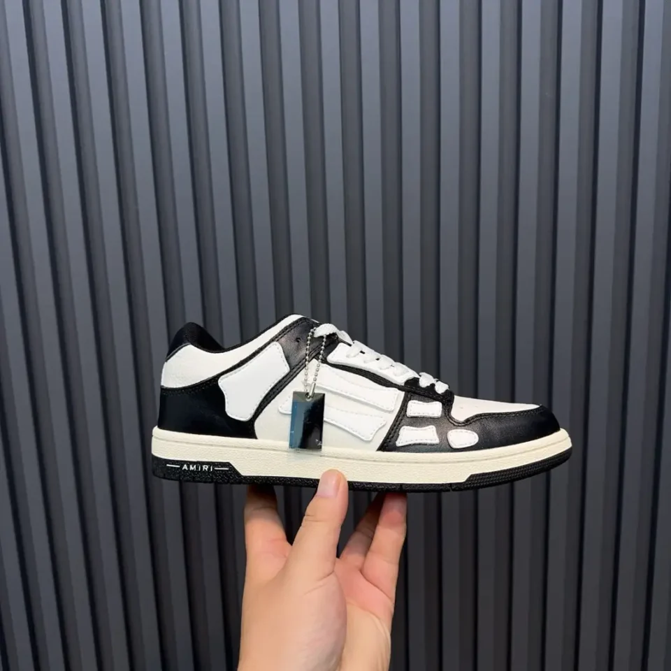 Amiri MC01 black white leather low-top sneakers with branded tag and cushioned sole