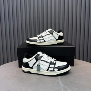 Amiri Holzer Low black white leather sneakers with tag and rubber sole on box background