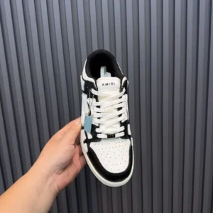 Amiri Skel Top low white black leather sneakers with perforated toe box and lace-up design