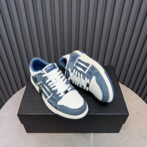 Amiri Skel Toe denim blue white perforated leather sneakers with white laces on black box