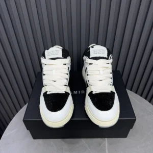 Amiri Skel Top black white leather sneakers with mesh panels on black box background