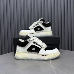 Amiri Skel Top low black white leather mesh sneakers with cream sole and logo detailing