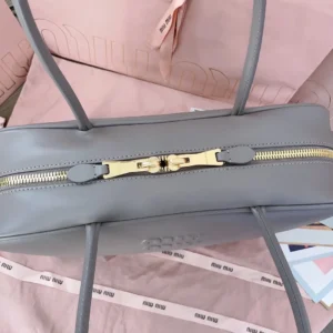 Miu Miu Embossed Logo Tote Bag medium gray smooth leather gold-tone zipper closure