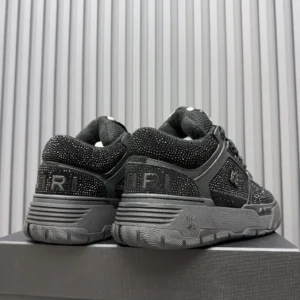 Amiri MC01 black rhinestone mesh suede sneakers with textured sole and embossed branding