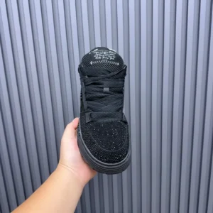 Amiri Skel Top black colorway mesh and suede sneakers with studded detailing