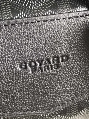 Goyard Cisalpin Backpack interior detail featuring embossed "GOYARD PARIS" logo on textured leather.