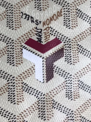 Goyard White Tote Bag featuring distinctive logo and patterned fabric, showcasing high-quality craftsmanship and exclusive design elements.