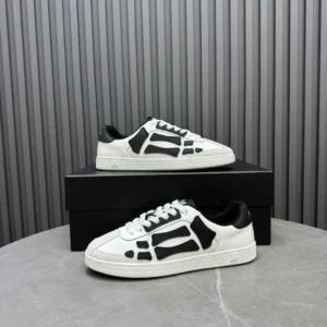 Axel Arigato Clean 90 white black leather sneakers with embroidered logo and textured sole