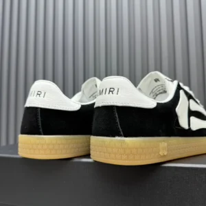 Amiri Mick Low black white suede sneakers with gum rubber sole and leather heel tab