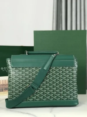 Goyard Citadin Mailman Bag in green, featuring a textured design and detachable shoulder strap, displayed against a green background with packaging elements.