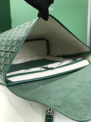 Goyard Citadin Mailman Bag interior view showcasing green leather and canvas material, highlighting zipper compartments and elegant design for versatile use.