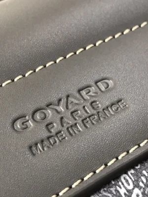 Goyard Paris logo embossed on smooth leather, showcasing craftsmanship of the luxury Citadin Mailman Bag.