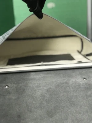 Interior view of Goyard Citadin Mailman Bag showcasing smooth leather and cotton-linen canvas materials, emphasizing luxury and functionality.