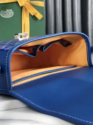 Goyard Belvedere 2nd Generation Bag interior showcasing blue leather and orange lining, highlighting built-in pockets and elegant design features.