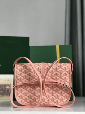 Metallic leather crossbody shoulder purse featuring Goyard's signature pattern, adjustable straps, and minimalist design, set against a blurred background of green boxes.