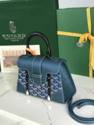 Pearl Green Goyard Sa ï gon mini bag with original packaging and box, showcasing its elegant design and craftsmanship.