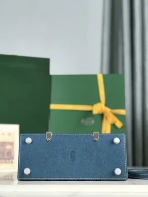Pearl Green Goyard Sa ï gon mini bag displayed with original packaging and box, featuring a sleek design and detachable leather shoulder strap.