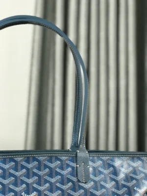 Goyard Pearl Blue tote bag featuring distinctive blue pattern and handles, highlighting luxury design and craftsmanship.