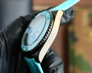 Unbranded dive watch blue dial turquoise bezel black stainless steel case with turquoise fabric strap
