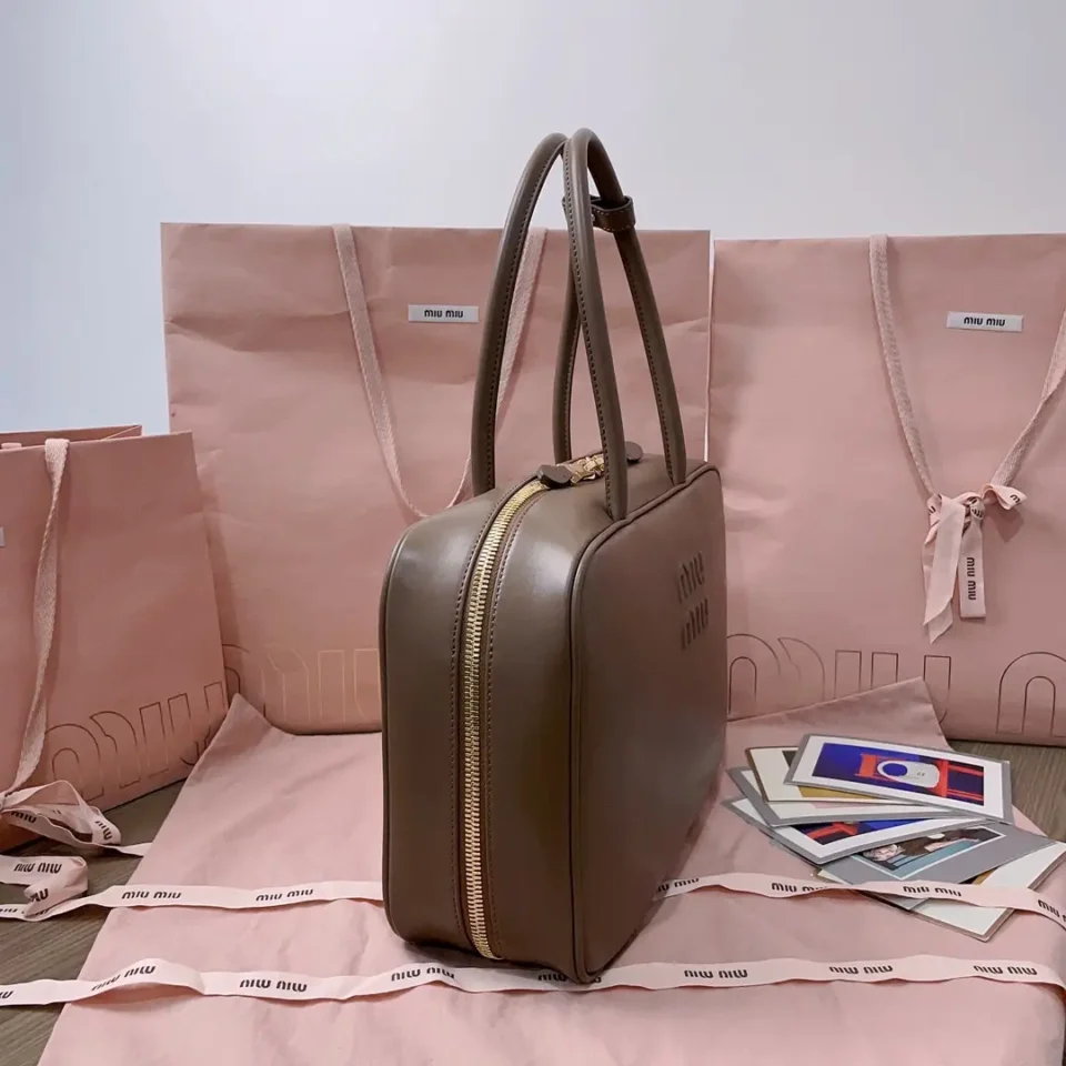 Miu Miu leather handbag small taupe smooth leather with gold zipper and double handles