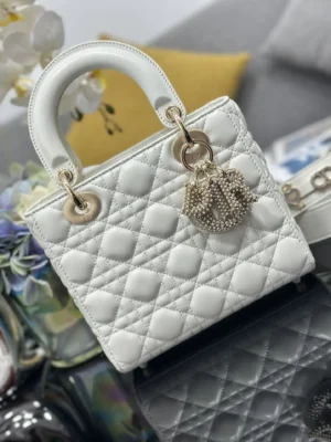 Dior Lady Dior small white lambskin leather handbag with gold-tone hardware and quilted stitching