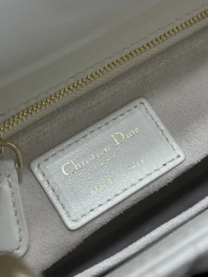 Christian Dior handbag interior label white leather gold text made in Italy