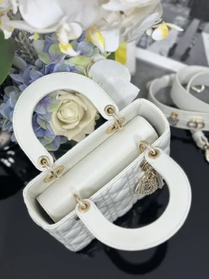 Christian Dior Lady Dior Medium white leather bag with gold hardware and charm details